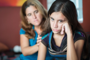 Teenager problems - Mother comforts her troubled teenage daughter